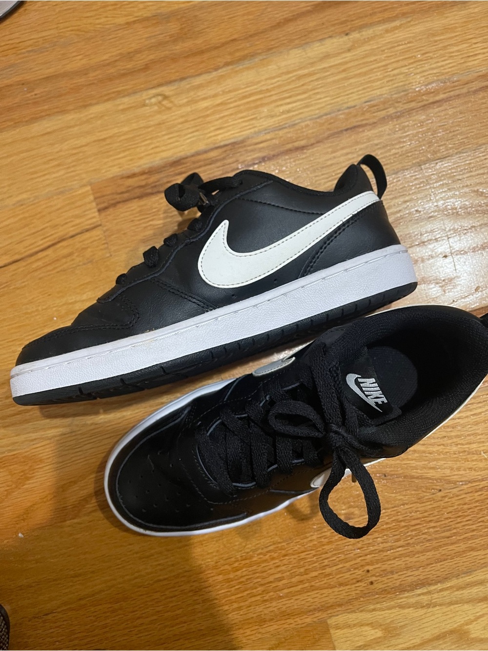 Nike Kids Black Sneakers with White Swoosh